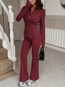 Women's Y2K burgundy sports tracksuit featuring a slim fit zipper jacket and flared pants