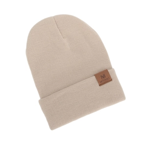 Detail of beige knit beanie showing the ribbed texture and brown leather 'M' patch
