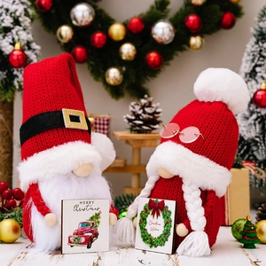 Christmas gnome plush dolls with knitted hats and wooden signs on a festive background