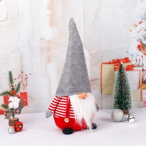 Swedish Christmas gnome plush doll in red and grey with festive holiday decorations