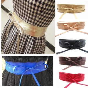 Women's wide faux leather waist belt with bow tie detail for dresses and coats