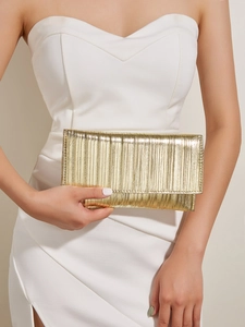 Close-up of a gold metallic pleated envelope evening clutch bag with flap closure