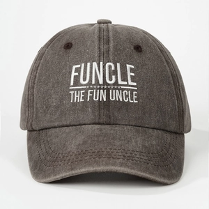 Detailed view of the white FUNCLE THE FUN UNCLE embroidery on a grey washed denim cap