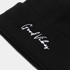 Street style black ribbed beanie with Good Vibes white embroidery on folded cuff
