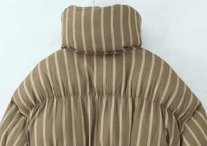 Detail view of coffee and khaki striped quilted jacket featuring stand collar and back stitching