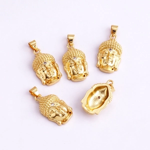 Detailed view of golden Buddha head pendants with hollow back for DIY jewelry making