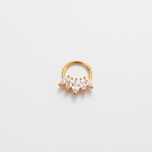 Macro shot of 16G gold nose ring with five marquise-cut marquise cubic zirconia stones