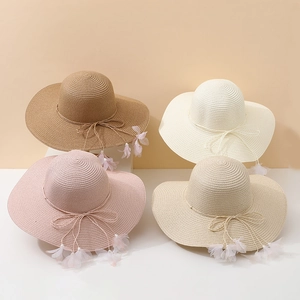 Summer wide brim straw sun hats for women featuring elegant bowknot and petal tassels