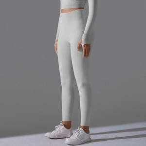 Detail of light grey yoga set showing thumb holes and high waist seamless leggings