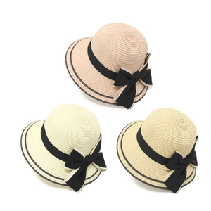 Women's summer straw sun hats in pink, beige and khaki with black bow tie decoration