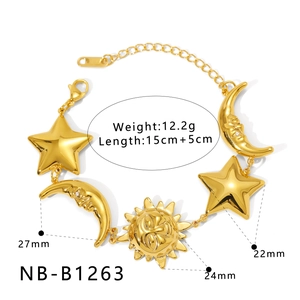 Detailed view of gold bracelet charms featuring sun moon and star celestial motifs