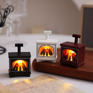 Mini LED fireplace night light with realistic burning wood effect in three classic colors