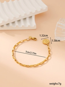 Detailed view of golden stainless steel chain bracelet with coin pendant and dimensions