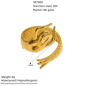 Detail of 18K gold plated stainless steel mermaid tail ring with engraved scale texture