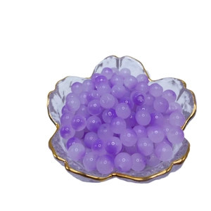Translucent purple 8mm glass beads in a gold-rimmed petal bowl for DIY jewelry
