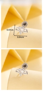 Macro shot of angel wing heart stud earring with 0.84cm width and 0.47cm height