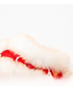 Detailed view of the red pet Tang suit collar with white faux fur and pearl accents