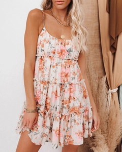 Detailed view of floral tiered dress with spaghetti straps and layered chiffon ruffles