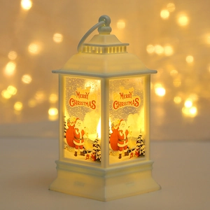 Close-up of white vintage Christmas lantern with Santa Claus and warm LED light effect