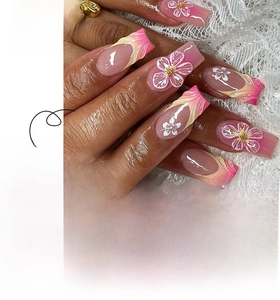 Close-up of French short square press-on nails with pink blush gradient and white floral art