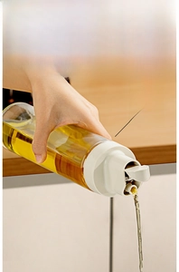 Macro detail of gravity sensing automatic lid opening and anti-drip oil pourer nozzle