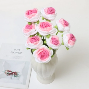 Handcrafted crochet rose bouquet in pink and white gradient with a white ceramic vase