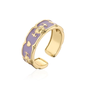 Detail of 18K gold plated crown ring with purple enamel and zircon inlay