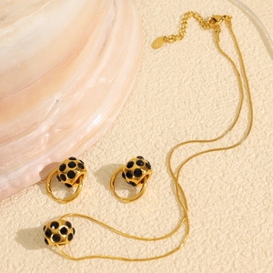 Parure de bijoux dorés style Maillard avec collier et boucles d'oreilles rotatives