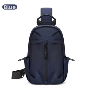 Detail of blue oxford fabric chest bag showing waterproof texture and zipper pockets