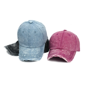 Vintage washed cotton baseball caps with distressed ripped brims in multiple colors