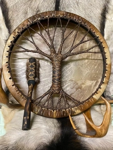 Close-up of Shaman drum with Tree of Life woven design and fur-wrapped drumstick