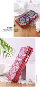 Ethnic mandala patterned long wallet with gold zipper shown in a cozy lifestyle setting