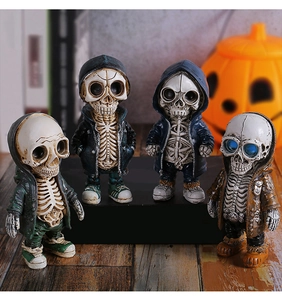 Detailed set of four creative skull figurines in colorful hoodies for Halloween decor