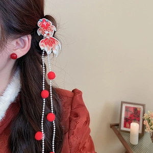 Detailed view of traditional Chinese style koi embroidery hairclip with long pearl tassels