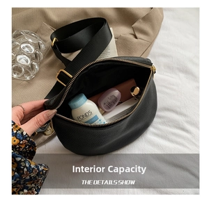 Detail of black litchi leather chest bag showing internal capacity for cosmetics