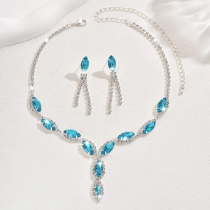 Detailed view of silver bridal jewelry set with marquise blue crystals and tassels