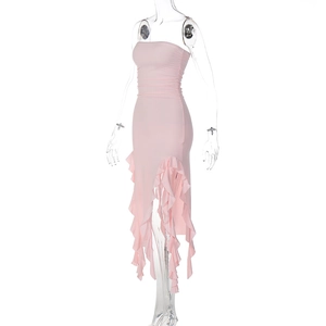 Detail of pink strapless bodycon dress featuring asymmetric hem and ruffled side pleats