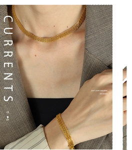 Detail of gold woven mesh texture necklace and bracelet set on a professional model
