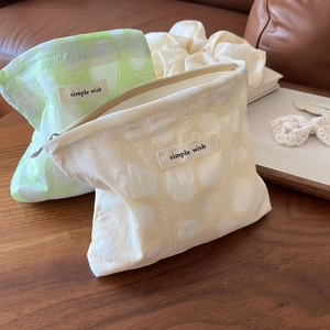 Pastel green and cream pleated dot jacquard cosmetic bags with simple wish label