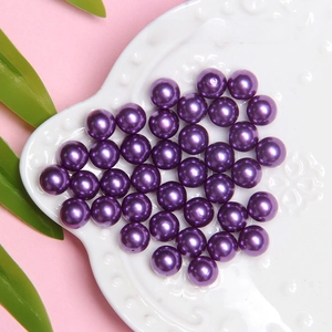Close-up of 8mm lavender ABS imitation pearls with glossy finish for DIY crafts