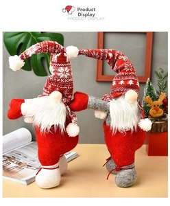 Detailed view of handmade Christmas gnomes with knitted hats and white plush beards