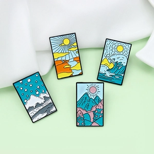 Set of four seasons enamel brooches featuring landscape sunrise and mountain designs