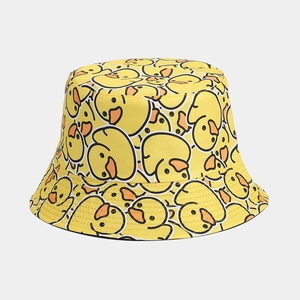 Detail shot of canvas bucket hat featuring cute yellow duck prints and neat stitching