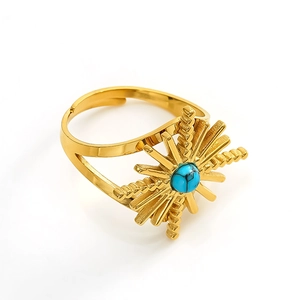 Detail of vintage gold sunburst ring with turquoise stone and adjustable band