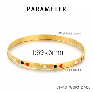 Detail view of 18K gold plated stainless steel heart bangles set with size parameters