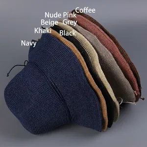 Foldable handmade straw sun hats for women in multiple colors shown in a stack