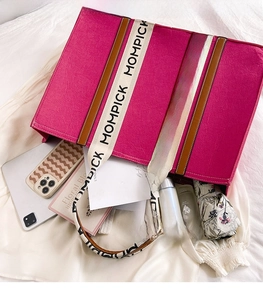 Interior view showing the large capacity of the fuchsia felt tote bag for essentials