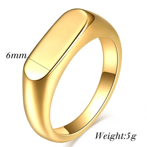 Detail shot of 6mm polished gold oval signet ring showing 5g weight and dimensions