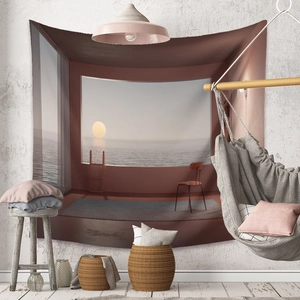 Detail of bohemian tapestry featuring a sunset sea view on a textured white wall