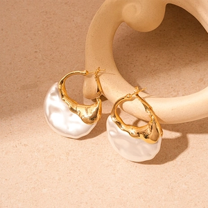 Retro golden geometric earrings with irregular white pearls in minimalist French style